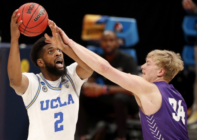 UCLA Bruins forward Cody Riley (2) is fouled by Abilene Christian Wildcats center Kolton Kohl (34) during the second round of the 2021 NCAA Tournament on Monday, March 22, 2021, at Bankers Life Fieldhouse in Indianapolis, Ind. Mandatory Credit: Michael Caterina/IndyStar via USA TODAY Sports