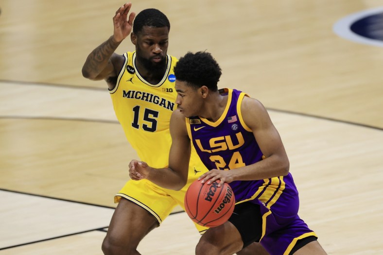 Mar 22, 2021; Indianapolis, Indiana, USA; Louisiana State Tigers guard Cameron Thomas (24) drives to the basket while Michigan Wolverines guard Chaundee Brown (15) defends during the first half in the second round of the 2021 NCAA Tournament at Lucas Oil Stadium. Mandatory Credit: Aaron Doster-USA TODAY Sports