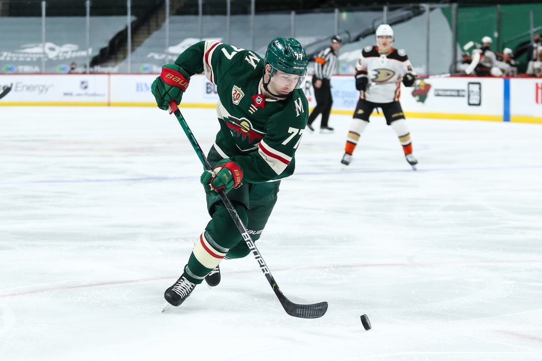 Mar 22, 2021; Saint Paul, Minnesota, USA; Minnesota Wild defenseman Brad Hunt (77) skates with the puck against the Anaheim Ducks in the second period at Xcel Energy Center. Mandatory Credit: David Berding-USA TODAY Sports