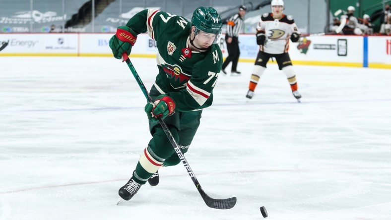 Mar 22, 2021; Saint Paul, Minnesota, USA; Minnesota Wild defenseman Brad Hunt (77) skates with the puck against the Anaheim Ducks in the second period at Xcel Energy Center. Mandatory Credit: David Berding-USA TODAY Sports