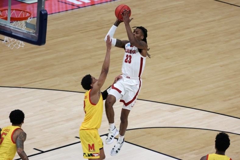 Mar 22, 2021; Indianapolis, Indiana, USA; Alabama Crimson Tide guard John Petty Jr. (23) shoots against Maryland Terrapins guard Aaron Wiggins (2) in the second half in the second round of the 2021 NCAA Tournament at Bankers Life Fieldhouse. Mandatory Credit: Trevor Ruszkowski-USA TODAY Sports