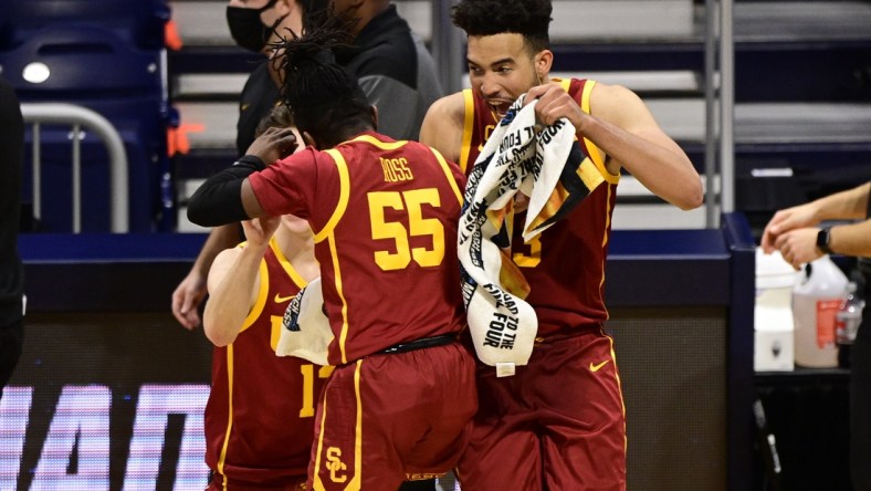 Mar 22, 2021; Indianapolis, Indiana, USA; Southern California Trojans forward Isaiah Mobley (3) celebrates with guard Amar Ross (55) during the second half in the second round of the 2021 NCAA Tournament against the Kansas Jayhawks at Hinkle Fieldhouse. Mandatory Credit: Marc Lebryk-USA TODAY Sports