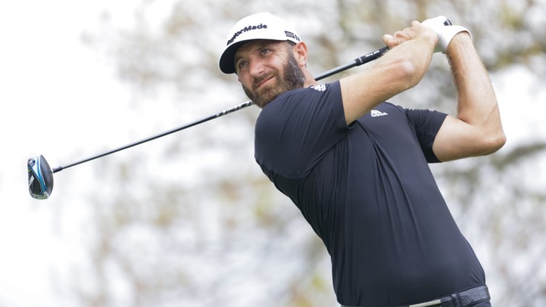 Mar 24, 2021; Austin, Texas, USA; Dustin Johnson plays his shot from the sixth tee during the first day of the WGC Dell Technologies Match Play golf tournament at Austin Country Club. Mandatory Credit: Erich Schlegel-USA TODAY Sports