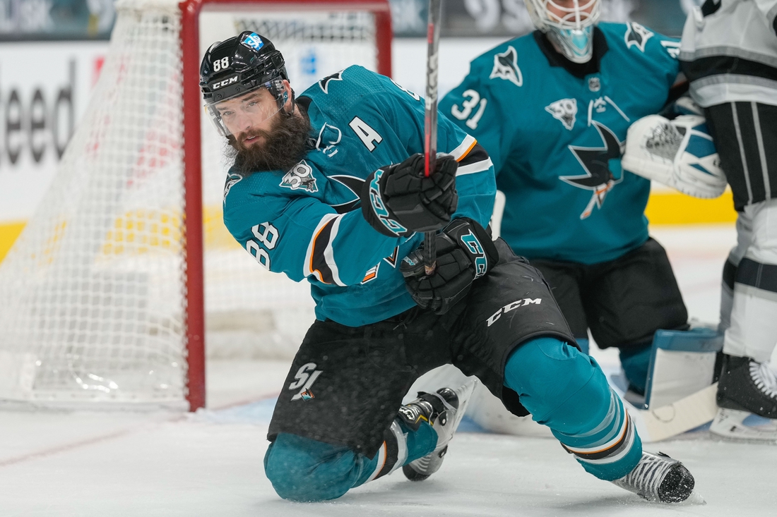 Mar 24, 2021; San Jose, California, USA;  San Jose Sharks defenseman Brent Burns (88) passes the puck during the first period against the Los Angeles Kings at SAP Center at San Jose. Mandatory Credit: Stan Szeto-USA TODAY Sports