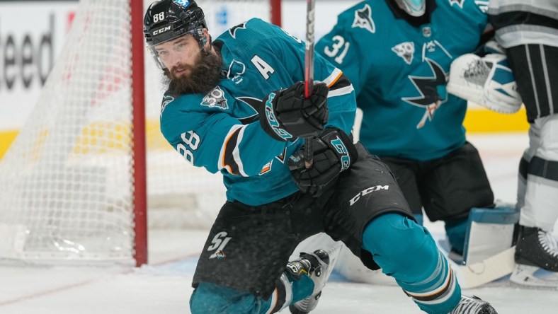 Mar 24, 2021; San Jose, California, USA;  San Jose Sharks defenseman Brent Burns (88) passes the puck during the first period against the Los Angeles Kings at SAP Center at San Jose. Mandatory Credit: Stan Szeto-USA TODAY Sports