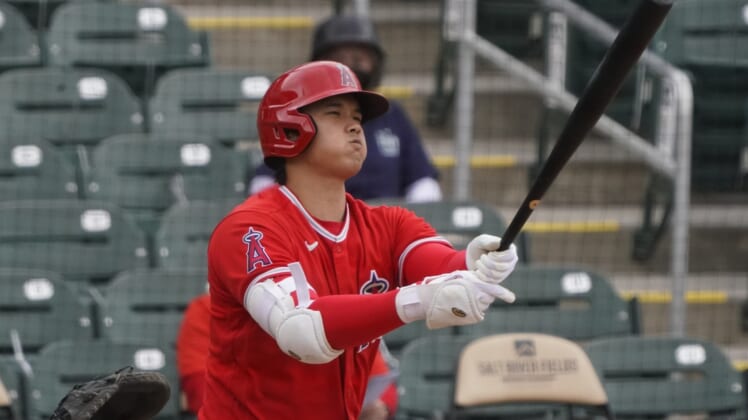 Mar 25, 2021; Salt River Pima-Maricopa, Arizona, USA; Los Angeles Angels designated hitter Shohei Ohtani (17) reacts after missing a pitch against the Colorado Rockies during a spring training game at Salt River Fields at Talking Stick. Mandatory Credit: Rick Scuteri-USA TODAY Sports