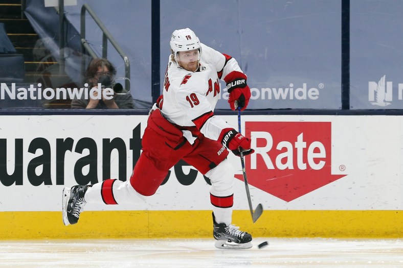 Mar 25, 2021; Columbus, Ohio, USA; Carolina Hurricanes defenseman Dougie Hamilton (19) shoots on goal against the Columbus Blue Jackets during the second period at Nationwide Arena. Mandatory Credit: Russell LaBounty-USA TODAY Sports