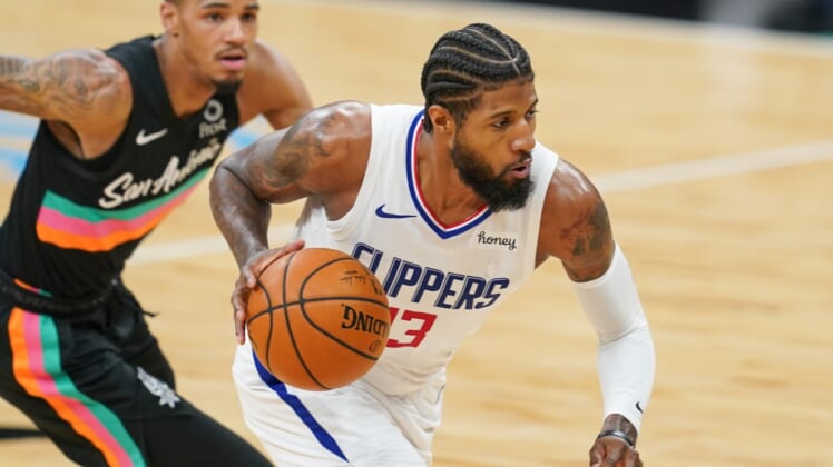 Mar 25, 2021; San Antonio, Texas, USA; Los Angeles Clippers guard Paul George (13) dribbles in the second half against the San Antonio Spurs at the AT&T Center. Mandatory Credit: Daniel Dunn-USA TODAY Sports