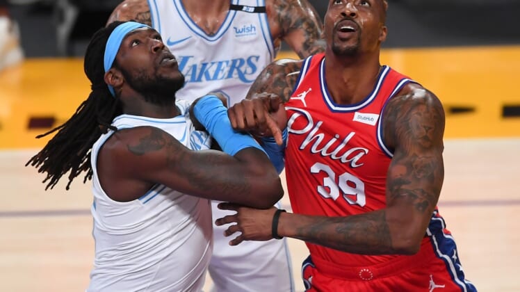 Mar 25, 2021; Los Angeles, California, USA;  Los Angeles Lakers center Montrezl Harrell (15) and Philadelphia 76ers center Dwight Howard (39) battle for position on the court in the first half of the game at Staples Center. Mandatory Credit: Jayne Kamin-Oncea-USA TODAY Sports