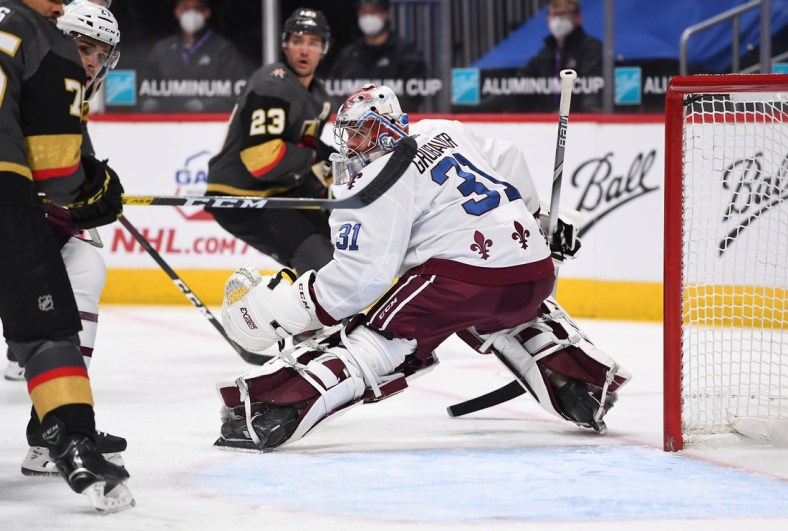 Mar 27, 2021; Denver, Colorado, USA; Colorado Avalanche goaltender Philipp Grubauer (31) defends his net in the first period against the Vegas Golden Knights at Ball Arena. Mandatory Credit: Ron Chenoy-USA TODAY Sports