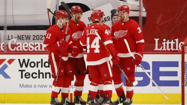 Mar 27, 2021; Detroit, Michigan, USA; Detroit Red Wings right wing Anthony Mantha (39) is congratulated by teammates after scoring in the third period against the Columbus Blue Jackets at Little Caesars Arena. Mandatory Credit: Rick Osentoski-USA TODAY Sports
