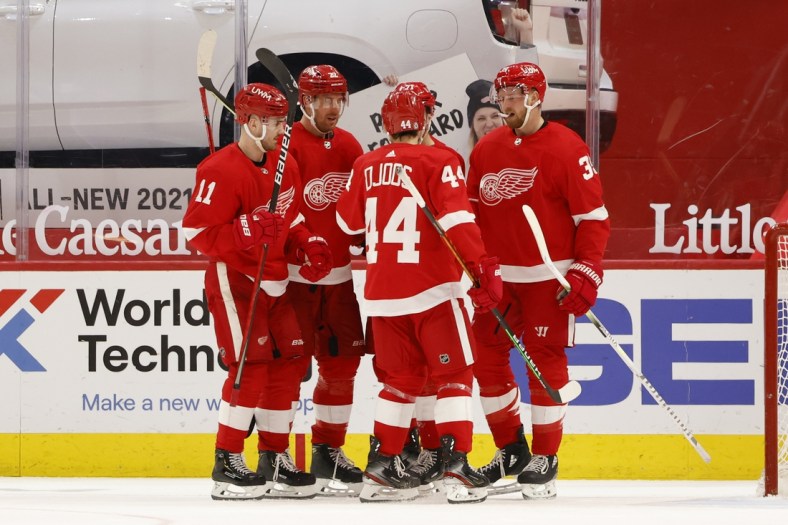 Mar 27, 2021; Detroit, Michigan, USA; Detroit Red Wings right wing Anthony Mantha (39) is congratulated by teammates after scoring in the third period against the Columbus Blue Jackets at Little Caesars Arena. Mandatory Credit: Rick Osentoski-USA TODAY Sports