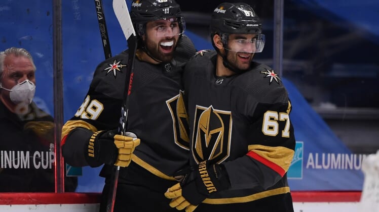 Mar 27, 2021; Denver, Colorado, USA;Vegas Golden Knights left wing Max Pacioretty (67) and Vegas Golden Knights right wing Alex Tuch (89) celebrate an overtime period win over the Colorado Avalanche at Ball Arena. Mandatory Credit: Ron Chenoy-USA TODAY Sports