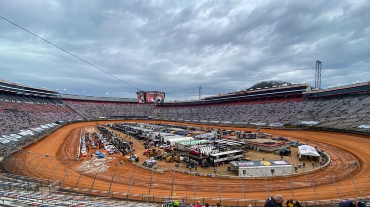 Mar 27, 2021; Bristol, TN, USA; General view of NASCAR Gander RV and Outdoors Truck Series trucks after one lap of qualifying for the Pinty's Truck Race on Dirt at Bristol Motor Speedway. Mandatory Credit: Randy Sartin-USA TODAY Sports