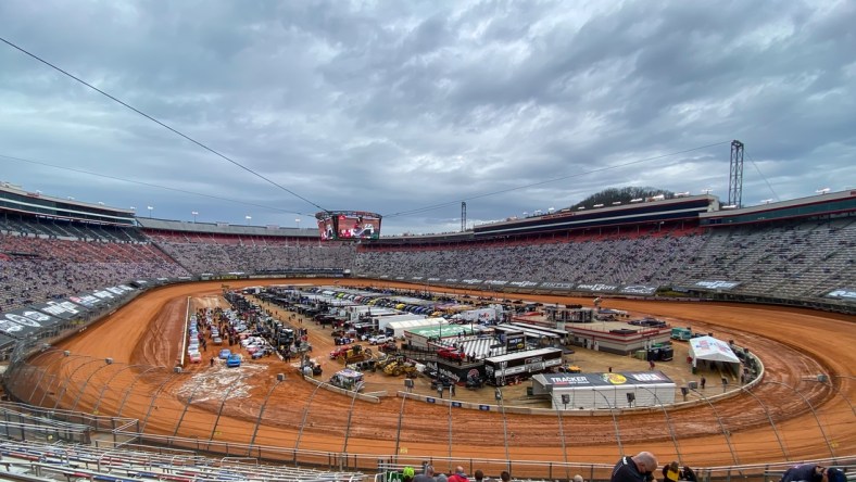 Mar 27, 2021; Bristol, TN, USA; General view of NASCAR Gander RV and Outdoors Truck Series trucks after one lap of qualifying for the Pinty's Truck Race on Dirt at Bristol Motor Speedway. Mandatory Credit: Randy Sartin-USA TODAY Sports