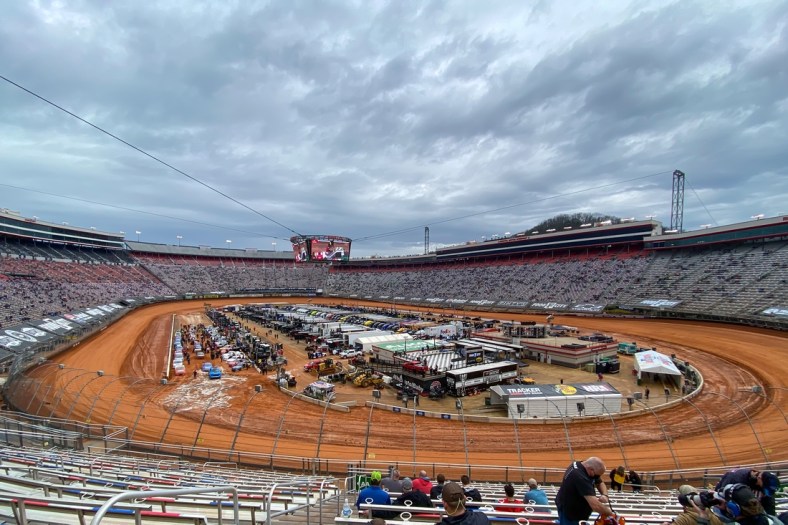 Mar 27, 2021; Bristol, TN, USA; General view of NASCAR Gander RV and Outdoors Truck Series trucks after one lap of qualifying for the Pinty's Truck Race on Dirt at Bristol Motor Speedway. Mandatory Credit: Randy Sartin-USA TODAY Sports