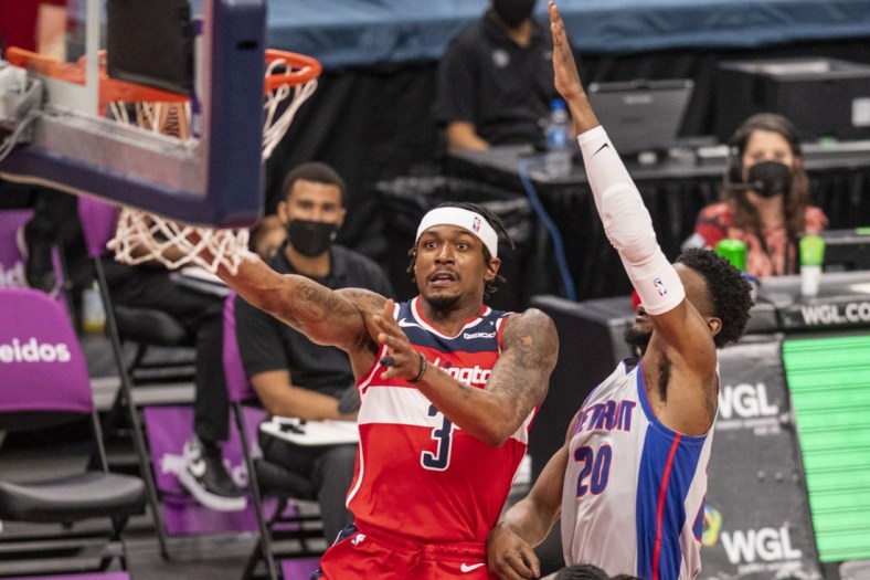 Mar 27, 2021; Washington, District of Columbia, USA;  Washington Wizards guard Bradley Beal (3) shoots as Detroit Pistons guard Josh Jackson (20) defends during the first half at Capital One Arena. Mandatory Credit: Tommy Gilligan-USA TODAY Sports
