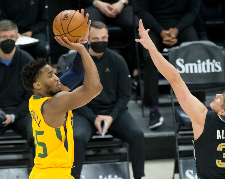 Mar 27, 2021; Salt Lake City, Utah, USA; Utah Jazz guard Donovan Mitchell (45) shoots the ball against Memphis Grizzlies guard Grayson Allen (3) during the first quarter at Vivint Smart Home Arena. Mandatory Credit: Russell Isabella-USA TODAY Sports