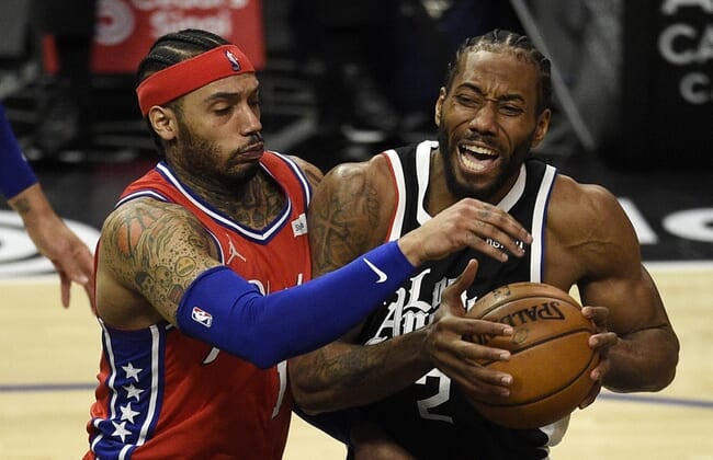Mar 27, 2021; Los Angeles, California, USA; LA Clippers forward Kawhi Leonard (2) drives to the basket while Philadelphia 76ers forward Mike Scott (1) defends during the first half at Staples Center. Mandatory Credit: Kelvin Kuo-USA TODAY Sports