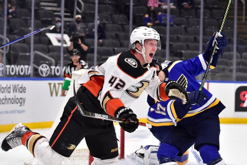 Mar 28, 2021; St. Louis, Missouri, USA;  Anaheim Ducks defenseman Josh Manson (42) reacts after scoring the game winning goal in overtime against the St. Louis Blues at Enterprise Center. Mandatory Credit: Jeff Curry-USA TODAY Sports