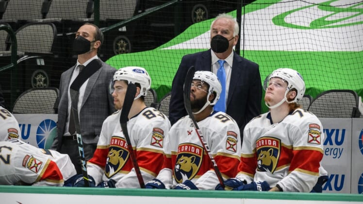 Mar 28, 2021; Dallas, Texas, USA; A view of the Florida Panthers bench and head coach Joel Norman Quenneville while medical staff attends to the injury of Florida Panthers defenseman Aaron Ekblad (not pictured) during the second period against the Dallas Stars at the American Airlines Center. Mandatory Credit: Jerome Miron-USA TODAY Sports