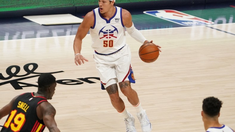 Mar 28, 2021; Denver, Colorado, USA; Denver Nuggets forward Aaron Gordon (50) controls the ball against the Atlanta Hawks in the first quarter at Ball Arena. Mandatory Credit: Ron Chenoy-USA TODAY Sports