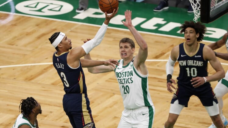 Mar 29, 2021; Boston, Massachusetts, USA; New Orleans Pelicans guard Josh Hart (3) goes to the basket past Boston Celtics forward Moritz Wagner (20) during the first quarter at TD Garden. Mandatory Credit: Winslow Townson-USA TODAY Sports
