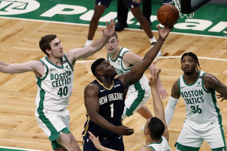 Mar 29, 2021; Boston, Massachusetts, USA; New Orleans Pelicans forward Zion Williamson (1) goes to the basket as Boston Celtics center Luke Kornet (40) and guard Marcus Smart (36) look on during the second quarter at TD Garden. Mandatory Credit: Winslow Townson-USA TODAY Sports