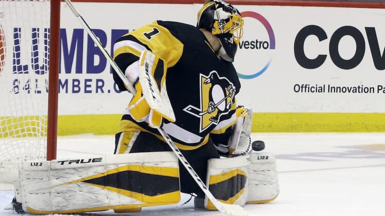 Mar 29, 2021; Pittsburgh, Pennsylvania, USA;  Pittsburgh Penguins goaltender Casey DeSmith (1) makes a save against the New York Islanders during the third period at PPG Paints Arena. Pittsburgh won 2-1 Mandatory Credit: Charles LeClaire-USA TODAY Sports