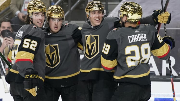 Mar 29, 2021; Las Vegas, Nevada, USA; Vegas Golden Knights celebrate after a goal by left wing Tomas Nosek (second from right) against the Los Angeles Kings during the second period at T-Mobile Arena. Mandatory Credit: John Locher/POOL PHOTOS-USA TODAY Sports