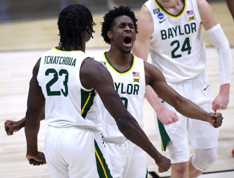 Baylor Bears forward Jonathan Tchamwa Tchatchoua (23) and Baylor Bears guard Adam Flagler (10) celebrate after sinking a basket while being fouled by Arkansas during the Elite Eight round of the 2021 NCAA Tournament on Monday, March 29, 2021, at Lucas Oil Stadium in Indianapolis, Ind. Mandatory Credit: Mykal McEldowney/IndyStar via USA TODAY Sports