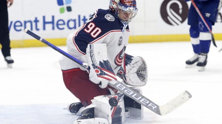 Mar 30, 2021; Tampa, Florida, USA ; Columbus Blue Jackets goaltender Elvis Merzlikins (90) makes a save against the Tampa Bay Lightning during the third period at Amalie Arena. Mandatory Credit: Kim Klement-USA TODAY Sports