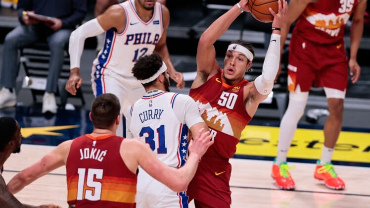 Mar 30, 2021; Denver, Colorado, USA; Denver Nuggets forward Aaron Gordon (50) corns the ball against Philadelphia 76ers guard Seth Curry (31) in the second quarter at Ball Arena. Mandatory Credit: Isaiah J. Downing-USA TODAY Sports