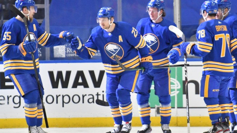 Mar 31, 2021; Buffalo, New York, USA; Buffalo Sabres defenseman Rasmus Ristolainen (55) congratulates center Sam Reinhart (23) after scoring a goal during the first period against the Philadelphia Flyers at KeyBank Center. Mandatory Credit: Mark Konezny-USA TODAY Sports