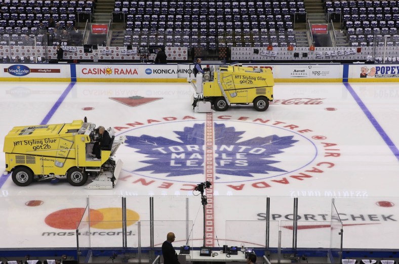 Oct 7, 2017; Toronto, Ontario, CAN; A general view of the logo at center ice as the zambonis clear the ice before the Toronto Maple Leafs home opener against the New York Rangers at Air Canada Centre. Mandatory Credit: Tom Szczerbowski-USA TODAY Sports