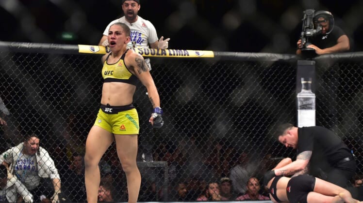 May 11, 2019; Rio de Janeiro, Brazil; Jessica Andrade (blue gloves) reacts to fight against Rose Namajunas (red gloves) during UFC 237 at Jeunesse Arena. Mandatory Credit: Jason Silva-USA TODAY Sports