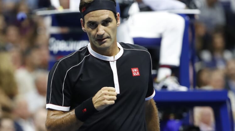 Sep 3, 2019; Flushing, NY, USA; Roger Federer of Switzerland reacts after winning a point against Grigor Dimitrov of Bulgaria (not pictured) in a quarterfinal match on day nine of the 2019 US Open tennis tournament at USTA Billie Jean King National Tennis Center. Mandatory Credit: Geoff Burke-USA TODAY Sports