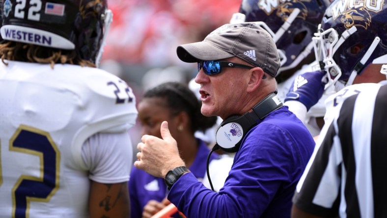 Sep 7, 2019; Raleigh, NC, USA;Western Carolina Catamounts head coach Mark Speir (center) talks to his players during the first half against the North Carolina State Wolfpack at Carter-Finley Stadium. Mandatory Credit: Rob Kinnan-USA TODAY Sports