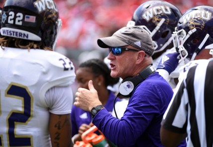 Sep 7, 2019; Raleigh, NC, USA;Western Carolina Catamounts head coach Mark Speir (center) talks to his players during the first half against the North Carolina State Wolfpack at Carter-Finley Stadium. Mandatory Credit: Rob Kinnan-USA TODAY Sports