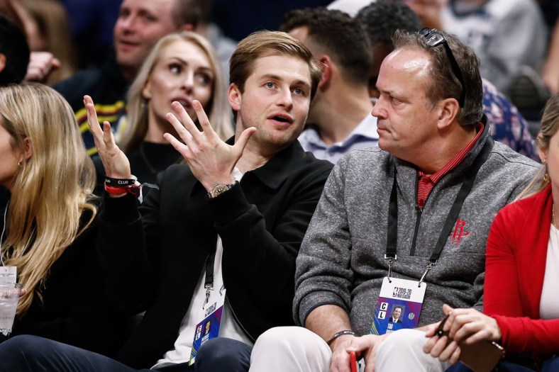 Nov 20, 2019; Denver, CO, USA; Patrick Fertitta (L), son of Houston Rockets owner Tilman Fertitta (not pictured), talks with Rockets CEO Tad Brown (R) in the third quarter of the game against the Denver Nuggets at the Pepsi Center. Mandatory Credit: Isaiah J. Downing-USA TODAY Sports