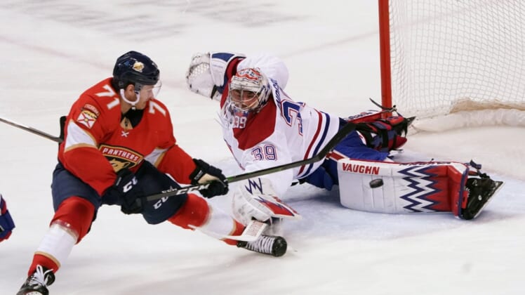 Mar 7, 2020; Sunrise, Florida, USA; Florida Panthers center Lucas Wallmark (71) scores a goal past Montreal Canadiens goaltender Charlie Lindgren (39) during the second period at BB&T Center. Mandatory Credit: Steve Mitchell-USA TODAY Sports