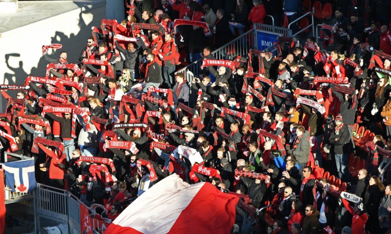 Mar 7, 2020; Toronto, Ontario, CAN;  Toronto FC fans hold up scarves during the national anthem before kickoff against the New York City at BMO Field. Mandatory Credit: Dan Hamilton-USA TODAY Sports