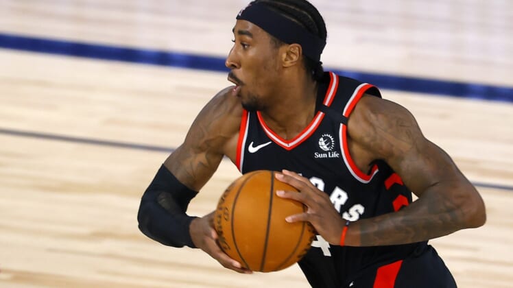 Aug 10, 2020; Lake Buena Vista, Florida, USA; Rondae Hollis-Jefferson #4 of the Toronto Raptors drives against the Milwaukee Bucks during the second quarter at The Field House at ESPN Wide World Of Sports Complex on August 10, 2020 in Lake Buena Vista, Florida. Mandatory Credit: Mike Ehrmann/Pool Photo-USA TODAY Sports