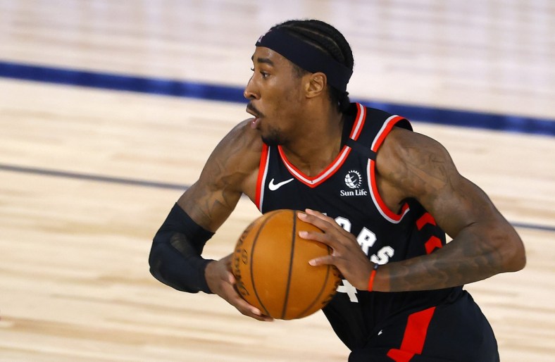 Aug 10, 2020; Lake Buena Vista, Florida, USA; Rondae Hollis-Jefferson #4 of the Toronto Raptors drives against the Milwaukee Bucks during the second quarter at The Field House at ESPN Wide World Of Sports Complex on August 10, 2020 in Lake Buena Vista, Florida. Mandatory Credit: Mike Ehrmann/Pool Photo-USA TODAY Sports