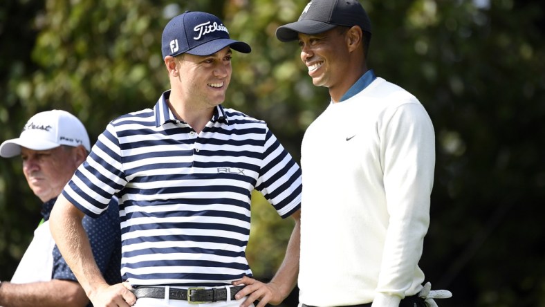 Sep 18, 2020; Mamaroneck, New York, USA; Justin Thomas and Tiger Woods talk on the 15th green during the second round of the U.S. Open golf tournament at Winged Foot Golf Club - West. Mandatory Credit: Danielle Parhizkaran-USA TODAY Sports