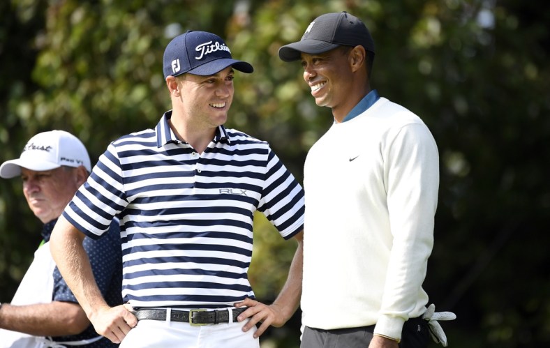 Sep 18, 2020; Mamaroneck, New York, USA; Justin Thomas and Tiger Woods talk on the 15th green during the second round of the U.S. Open golf tournament at Winged Foot Golf Club - West. Mandatory Credit: Danielle Parhizkaran-USA TODAY Sports