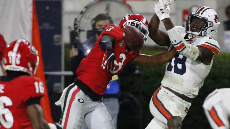 Oct 3, 2020; Athens, GA, USA; Georgia defensive back Tyson Campbell (3) breaks up a pass from Auburn quarterback Bo Nix (10) to Auburn wide receiver Seth Williams (18) during the second half of an NCAA college football game between Georgia and Auburn in Athens, Ga., on Saturday, Oct. 3, 2020. Georgia won 27-6.  Mandatory Credit: Joshua L. Jones-USA TODAY NETWORK