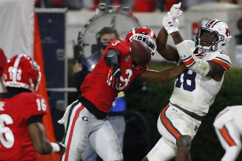 Oct 3, 2020; Athens, GA, USA; Georgia defensive back Tyson Campbell (3) breaks up a pass from Auburn quarterback Bo Nix (10) to Auburn wide receiver Seth Williams (18) during the second half of an NCAA college football game between Georgia and Auburn in Athens, Ga., on Saturday, Oct. 3, 2020. Georgia won 27-6.  Mandatory Credit: Joshua L. Jones-USA TODAY NETWORK