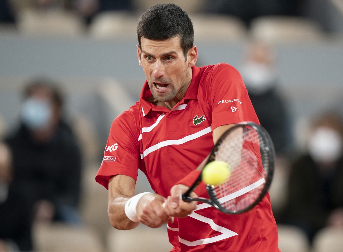 Oct 11, 2020;  Paris, France; Novak Djokovic (SRB) in action during his match against Rafael Nadal (ESP) on day 15 at Stade Roland Garros. Mandatory Credit: Susan Mullane-USA TODAY Sports