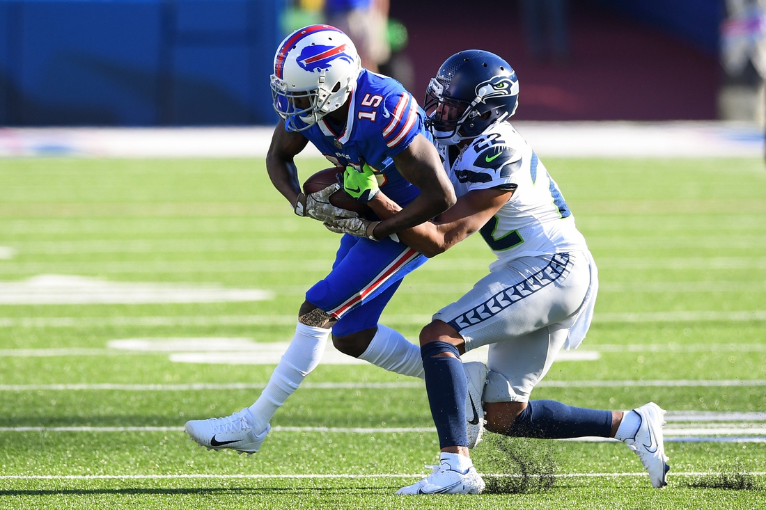 Nov 8, 2020; Orchard Park, New York, USA; Buffalo Bills wide receiver John Brown (15) catches a pass in front of Seattle Seahawks cornerback Quinton Dunbar (22) during the second quarter at Bills Stadium. Mandatory Credit: Rich Barnes-USA TODAY Sports